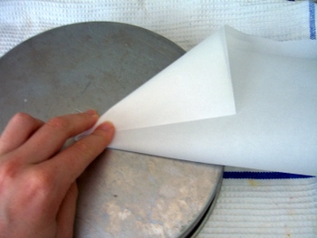 Lining a cake pan with parchment paper