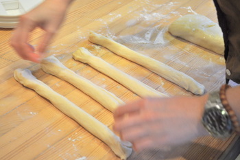 Stretching the dough into strands